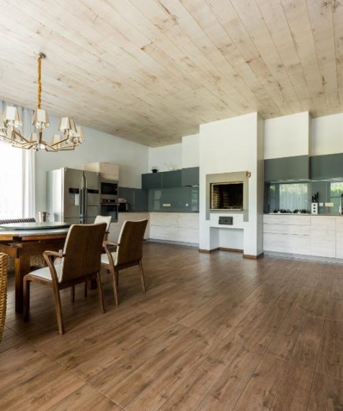 interior-view-of-stylish-empty-kitchen-and-dining--AUPM87W